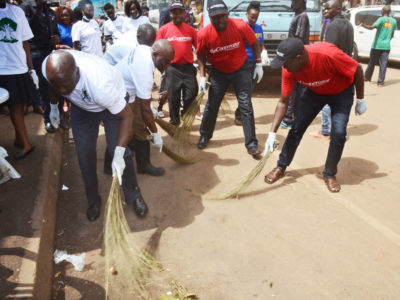 Minister on the left sweeping a section of the market Image